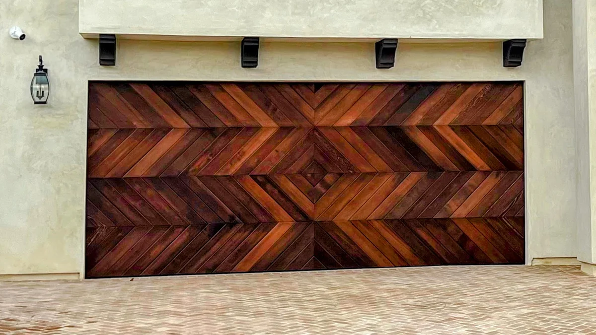 Custom clear western red cedar chevron pattern garage door installation in Laguna Niguel, Orange County CA