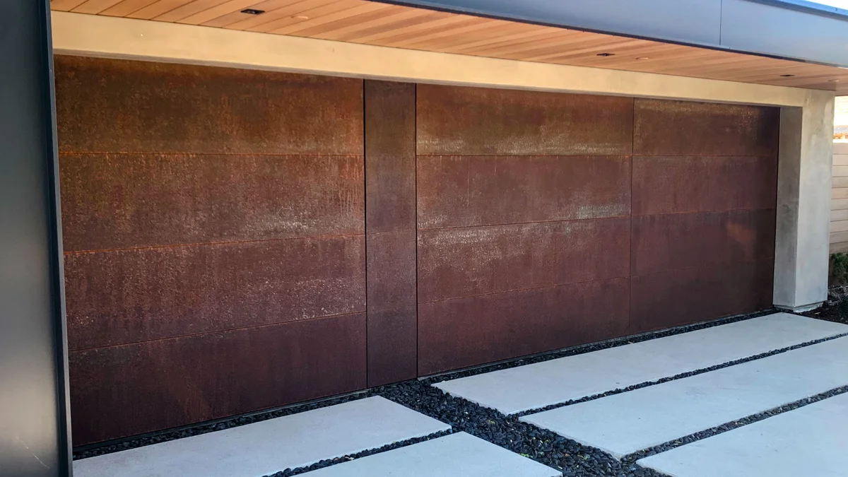 Custom corten steel clad garage door with natural rust patina in Laguna Beach, Orange County CA