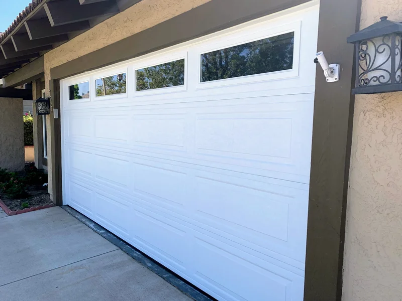 White Wayne-Dalton Model 8300 traditional garage door installation in Lake Forest, Orange County CA