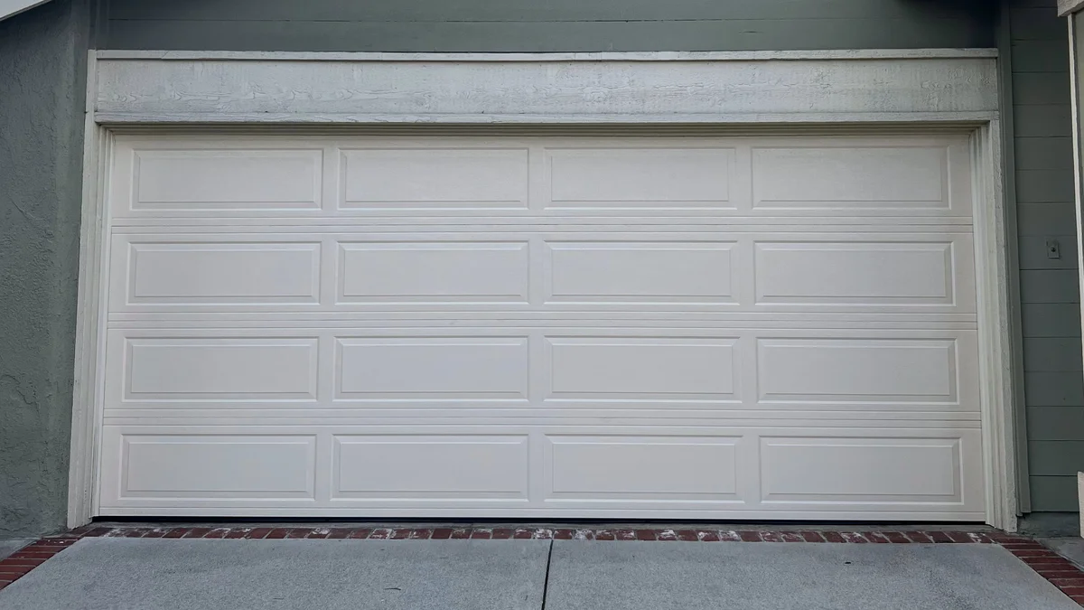 Traditional almond long panel garage door installation in Lake Forest, Orange County CA