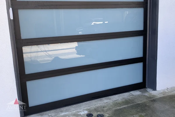 Black Anodized frame full-view glass garage door in Newport Coast, CA -- Avaunt Garage Doors