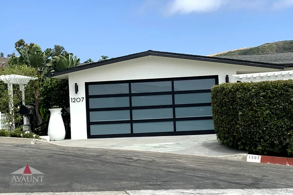 Black Anodized frame full-view glass garage door in Laguna Beach, CA -- Avaunt Garage Doors
