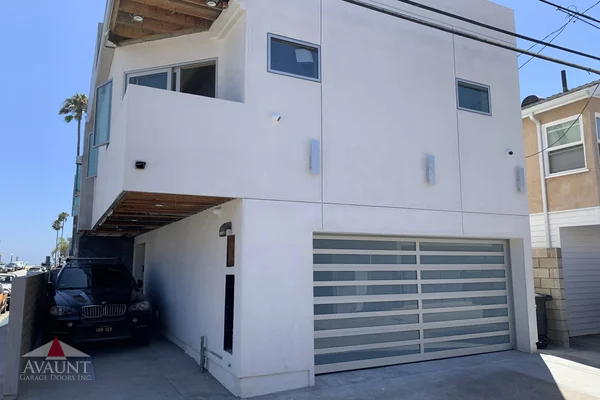 Clear Anodized frame full-view glass garage door in Newport Coast, CA -- Avaunt Garage Doors