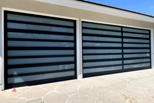 Black Anodized frame full-view glass garage door in Corona Del Mar, CA -- Avaunt Garage Doors