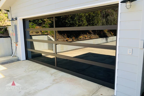 Black Anodized frame full-view glass garage door in Laguna Beach, CA -- Avaunt Garage Doors