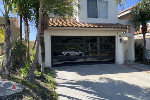 Black Anodized frame full-view glass garage door in Dana Point, CA -- Avaunt Garage Doors