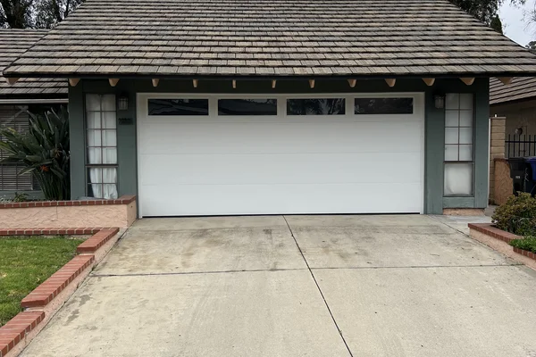 Flush Panel traditional garage door in Lake Forest, CA -- Avaunt Garage Doors